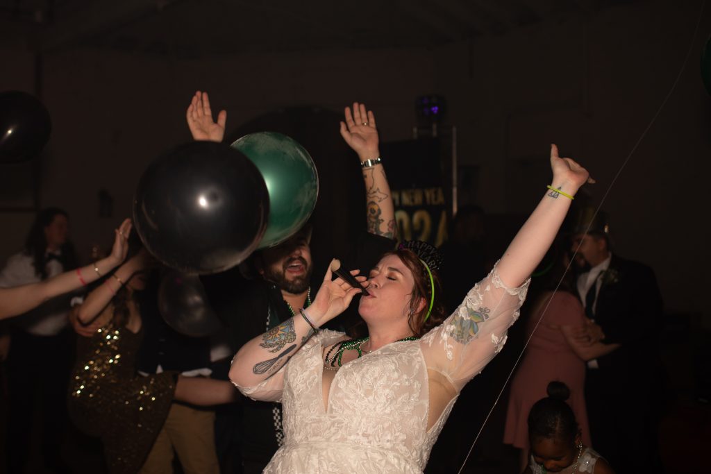 Bride dancing to wedding DJ while celebrating New Years